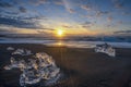 Raging waves smashing ice blocks at sunrise on Diamond Beach Royalty Free Stock Photo