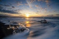 Raging waves smashing ice blocks at sunrise on Diamond Beach Royalty Free Stock Photo