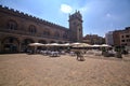 Ragione palace and square in front of it with tables of restaurant full of people