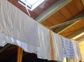Rags and towels hung out to dry after washing in the attic Royalty Free Stock Photo
