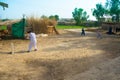 Rahimyar khan,punjab,pakistan-july 1,2019:some local boys playing cricket in a village