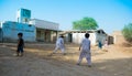 Rahimyar khan,punjab,pakistan-july 1,2019:some local boys playing cricket in a village