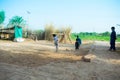 Rahimyar khan,punjab,pakistan-july 1,2019:some local boys playing cricket in a village