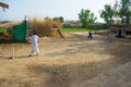 Rahimyar khan,punjab,pakistan-july 1,2019:some local boys playing cricket in a village