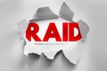RAID text with redundant array of independent disks concept revealed through torn paper surface, visual metaphor for data storage Royalty Free Stock Photo