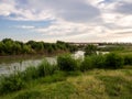 Rail carriages on the Texas Mexican Railway International Bridge across the Rio Grande River in Laredo, Texas, USA, with green