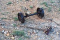 Rail cart wheels and an old mattock from a derelict mine Royalty Free Stock Photo