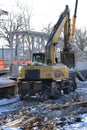 Rail excavator. Excavators machine excavate on railway. Construction of the underpass under the railway in winter. Russia