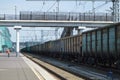 Rail freight cars moving on rails along the big station Royalty Free Stock Photo