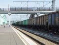 Rail freight cars moving on rails along the big station Royalty Free Stock Photo