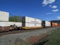 Rail road cars with intermodal containers of NFI RoadRail, JB Hunt, Swift and Schneider passing by West Haverstraw, NY. Royalty Free Stock Photo