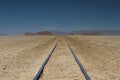 Rail track through the desert Royalty Free Stock Photo