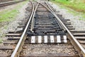 Rail tracks with rail sleepers at the railway pointwork. Change of direction. Railway arrows with rail track elements