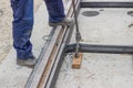 Rail worker tightening a bolt