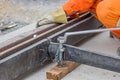 Rail worker tightening a bolt using wrench 2