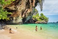 Railay, Thailand: women travelers in swimsuits enjoy the sand