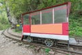 Railcar for the workers in the deep narrow Guam canyon. Western Caucasus. Royalty Free Stock Photo