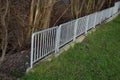 railing at the bridge with vertical fence bars anchored to the ground with Royalty Free Stock Photo