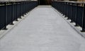 railing at the bridge with vertical fence bars anchored to the Royalty Free Stock Photo