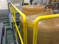 Railing with chemical tank at Deionized water system Royalty Free Stock Photo