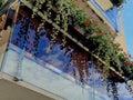 railing of a luxury house formed by glass panels fastened with metal stainless