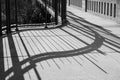 Railing shadow on the bridge. Bridge railing casts a shadow. Abstract bridge railing shadow Royalty Free Stock Photo