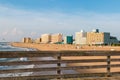 Railing of Virginia Beach Oceanfront Fishing Pier with Hotels Royalty Free Stock Photo