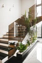 railings glass in black color modern staircase, glass ceiling and wall. modern industrial home office architecture.