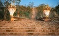 The railings of the stairs are. the Naga snake. Pakse, Laos