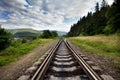 Railroad Against Mountains And Beautiful Sky, Near Forest. Royalty Free Stock Photo