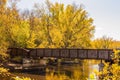 Railroad Bridge in Autumn Trees Royalty Free Stock Photo