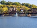 Tugboat by rail bridge between Dubuque Iowa and East Dubuque Illinois Royalty Free Stock Photo