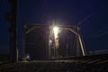 Railroad bridge over river at night, transportation construction Royalty Free Stock Photo