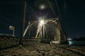 Railroad bridge over river at night, transportation construction Royalty Free Stock Photo