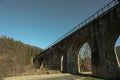 Railroad bridge in Ukrainian Carpathian mountains in sunny day Royalty Free Stock Photo