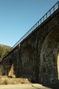 Railroad bridge in Ukrainian Carpathian mountains in sunny day Royalty Free Stock Photo