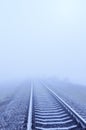 Railroad closeup to horizon in fog Royalty Free Stock Photo