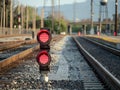 A railroad color position light sits ground level flashing red s Royalty Free Stock Photo