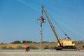 Railroad crane with a cradle lifted workers.