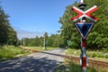 Railroad crossing gate on the forest at Gribskov, Denmark Royalty Free Stock Photo