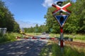 Railroad crossing gate on the forest at Gribskov on Denmark Royalty Free Stock Photo