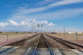 Railroad crossing gates on a road in the Mojave Desert Royalty Free Stock Photo