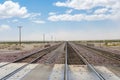 Railroad crossing gates on a road in the Mojave Desert Royalty Free Stock Photo