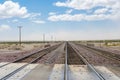 Railroad crossing gates on a road in the Mojave Desert