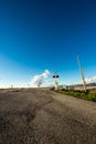 Railroad crossing with mountains behind Royalty Free Stock Photo