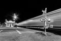 Railroad crossing by night with sign Royalty Free Stock Photo