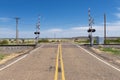 A railroad crossing in a rural area of the State of New Mexico Royalty Free Stock Photo