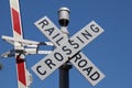 Railroad crossing sign on blue sky background Royalty Free Stock Photo