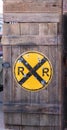 Railroad crossing sign mounted on a wooden box Royalty Free Stock Photo