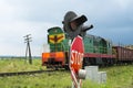 Railroad crossing signs and the approaching train Royalty Free Stock Photo